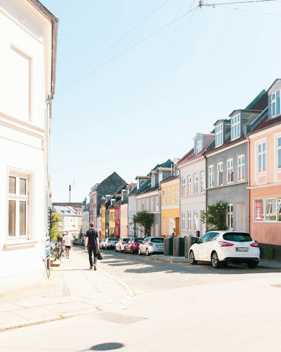 Documentary photograph of people talking on a street in a small Danish town