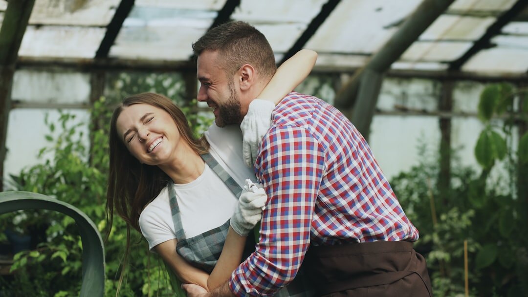 Danish family with two children laughing in a garden