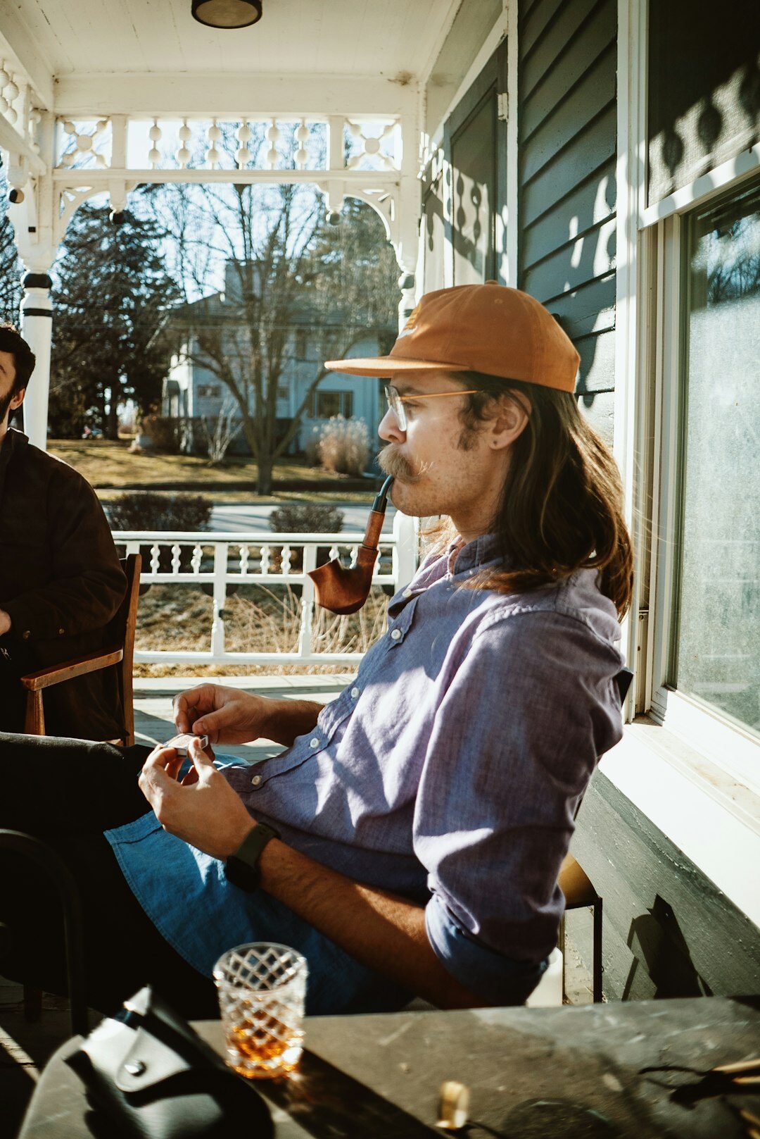 old man sitting on porch