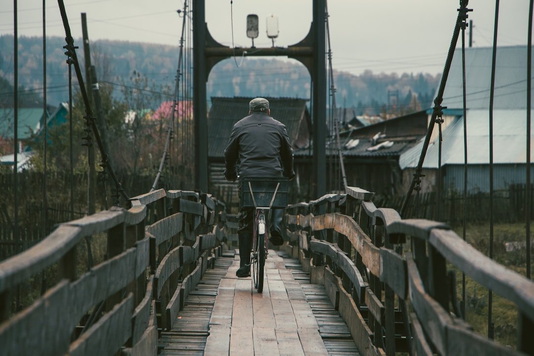 young man at village bridge